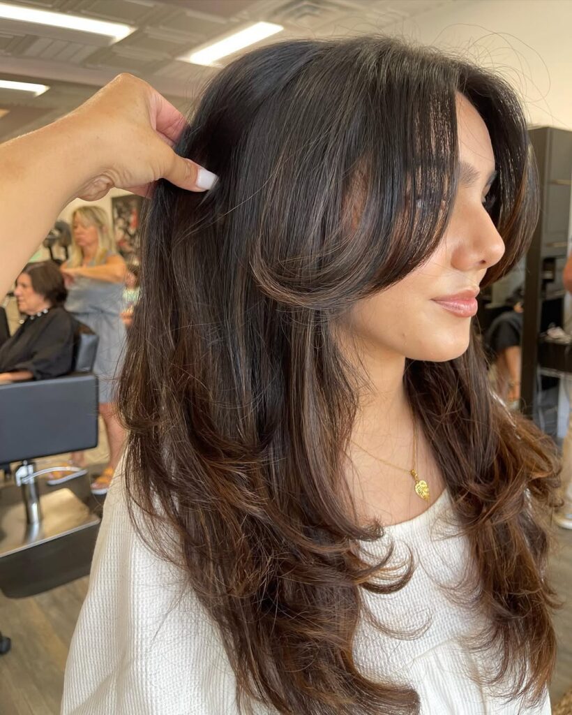 Long, Wavy Hair with Feathered Curtain Bangs