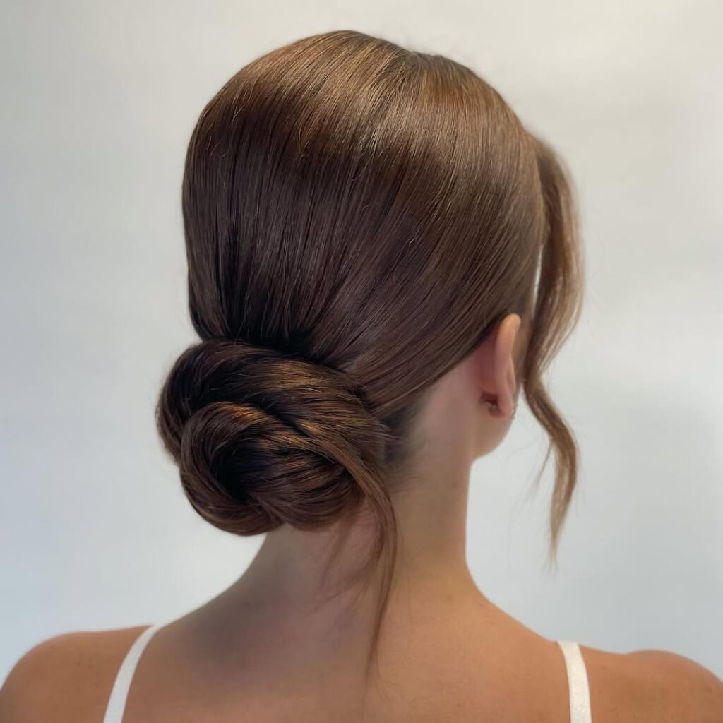 Low Messy Bun with Face-Framing Pieces