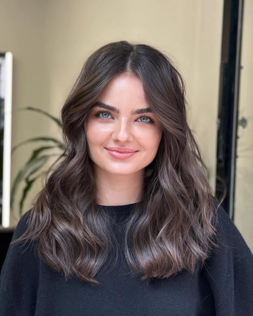 Sleek and Straight with Sharp Curtain Bangs