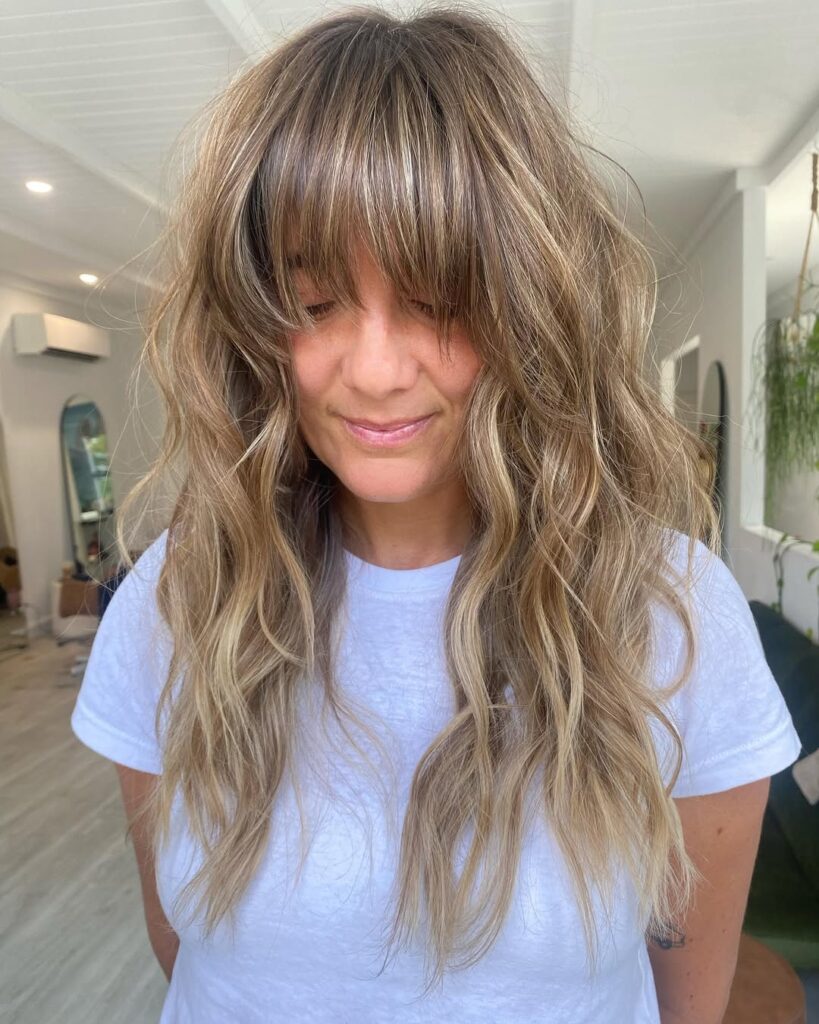 Top 14 Messy Hairstyles for Busy Mornings 9 Beachy Shag with Bangs